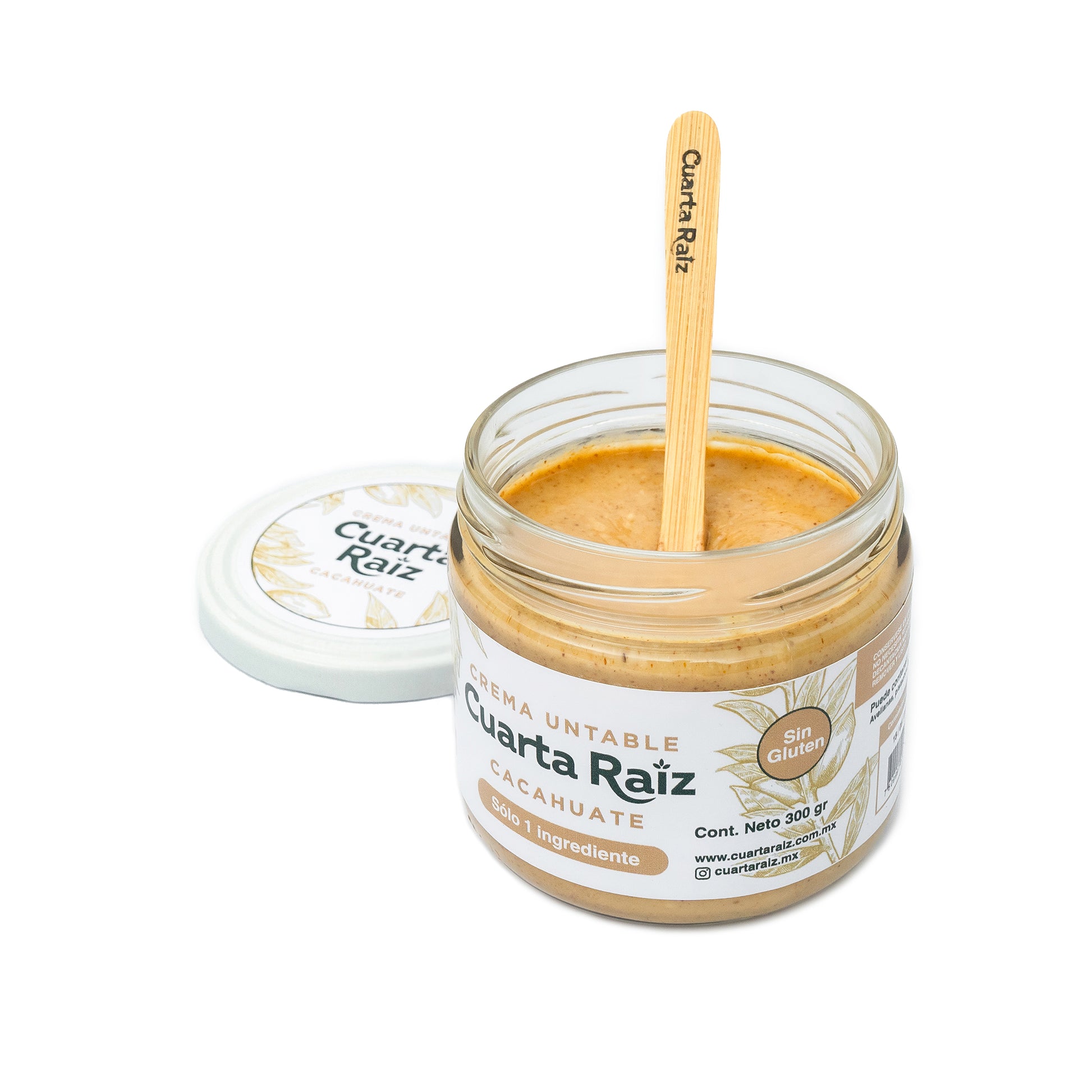 Frasco de crema de cacahuate Cuarta Raíz, 100% natural, sin azúcar, sin gluten, ideal para dietas keto. Producto vegano y saludable hecho en México, presentado con cuchara de bambú reutilizable